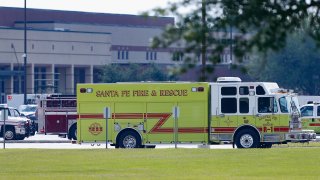 SANTA FE, TX – MAY 18: Emergency crews stage in the parking lot of Santa Fe High School where at least 10 students were killed on May 18, 2018 in Santa Fe, Texas. At least 10 people were killed when a gunman opened fire at Santa Fe High school. Police arrested a student suspect and detained a second person.