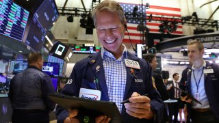 Traders work on the trading floor at the New York Stock Exchange (NYSE) in Manhattan, New York City, U.S., May 20, 2022. 