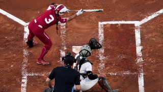 Grace Lyons #3 of the Oklahoma Sooners attempts to lay down a bunt during the first inning against the Texas Longhorns during the Division I Women's Softball Championship held at ASA Hall of Fame Stadium on June 8, 2022 in Oklahoma City, Oklahoma.