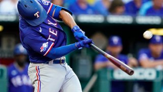 Marcus Semien #2 of the Texas Rangers hits a three-run home run against the Kansas City Royals during the third inning at Kauffman Stadium on June 28, 2022 in Kansas City, Missouri.