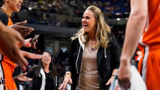Team Wilson head coach Becky Hammon talks to players during the first half of a WNBA All-Star basketball game against the Team Stewart in Chicago, Sunday, July 10, 2022.