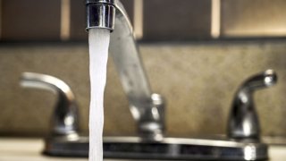 A faucet running water in a home