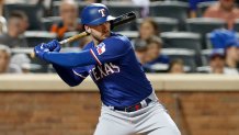 Texas Rangers catcher Mitch Garver (18) poses for a photo with