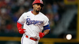 Marcus Semien #2 of the Texas Rangers rounds the bases after hitting a home run against the Minnesota Twins in the fourth inning at Globe Life Field on July 09, 2022 in Arlington, Texas.