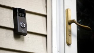 FILE - A Ring doorbell camera is seen outside a home in Wolcott, Conn., on July 16, 2019.