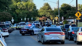 Dallas Police investigate a double-shooting on Wickersham Road, July 1, 2022.