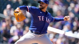 Texas Rangers starting pitcher Martin Perez works against the Colorado Rockies in the second inning of a baseball game Wednesday, Aug. 24, 2022, in Denver.