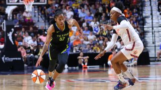 Dallas Wings guard Tyasha Harris (52) and Connecticut Sun guard Odyssey Sims (1) in action during the first round and game 1 of the WNBA playoffs between Dallas Wings and Connecticut Sun on August 18, 2022, at Mohegan Sun Arena in Uncasville, CT.