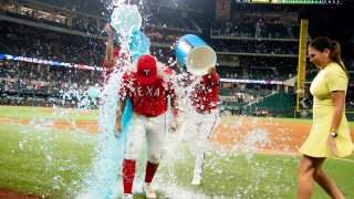 Mark Mathias #9 of the Texas Rangers is doused by gatorade after winning a game against the Detroit Tigers at Globe Life Field on August 26, 2022 in Arlington, Texas. Texas won the game by a final of 7-6.