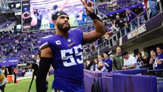Anthony Barr #55 of the Minnesota Vikings waves to fans in the stands fan as he walks off the field after a 31-17 win over the Chicago Bears at U.S. Bank Stadium on January 09, 2022 in Minneapolis, Minnesota.