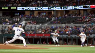 Kohei Arihara #35 of the Texas Rangers pitches against the Oakland Athletics in the top of the first inning at Globe Life Field on August 16, 2022 in Arlington, Texas.