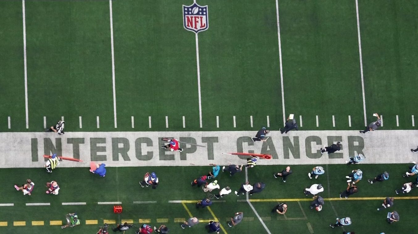 A member of the Dallas Cowboys wears a Crucial Catch hat during an NFL  football game