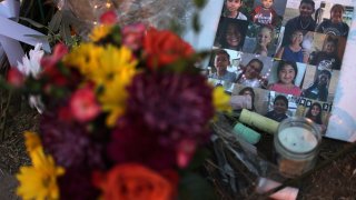 UVALDE, TEXAS – Flowers and photographs are placed at a memorial dedicated to the victims of the mass shooting at Robb Elementary School on June 3, 2022 in Uvalde, Texas. 19 students and two teachers were killed on May 24 after an 18-year-old gunman opened fire inside the school.