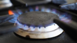 A gas hob burning on a stove.