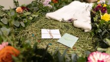 A demonstration "vessel" for the deceased, which has been decorated with flowers and compostable mementos by Return Home on top of a bed of straw, is pictured during a tour of the funeral home which specializes in human composting in Auburn, Washington on March 14, 2022. - Washington in 2019 became the first in the United States to make it a legal alternative to cremation. (Photo by Jason Redmond / AFP) 