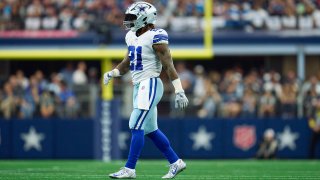 Ezekiel Elliott #21 of the Dallas Cowboys walks towards the huddle against the Detroit Lions during the first half of the game at AT&T Stadium on October 23, 2022 in Arlington, Texas.