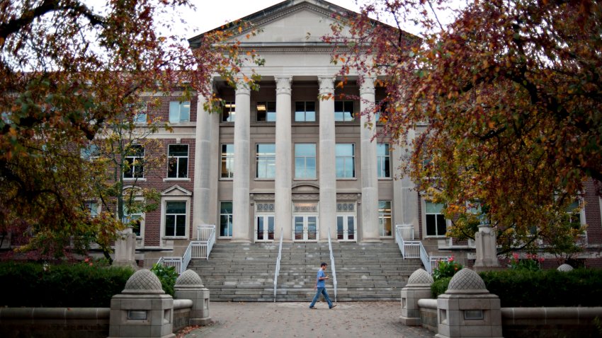 A student walks past the Hovde Hall of Administration building on the campus of Purdue University in West Lafayette, Indiana, U.S., on Monday, Oct. 22, 2012. Photographer:  Daniel Acker/Bloomberg via Getty Images