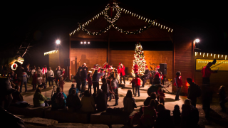 Exterior photo of a crowd at the Holidays at the Heard Museum