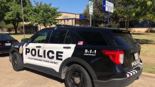 Dallas ISD Police outside John Carpenter Elementary, Oct. 13, 2022,, after a gun was accidentally fired in the school cafeteria.