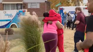 A crowd gathers outside of Central Visual and Performing Arts High School in St. Louis, Missouri after a school shooting on Monday, Oct. 24, 2022.