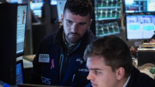 Traders work on the floor of the New York Stock Exchange (NYSE) in New York City, U.S., November 9, 2022. 