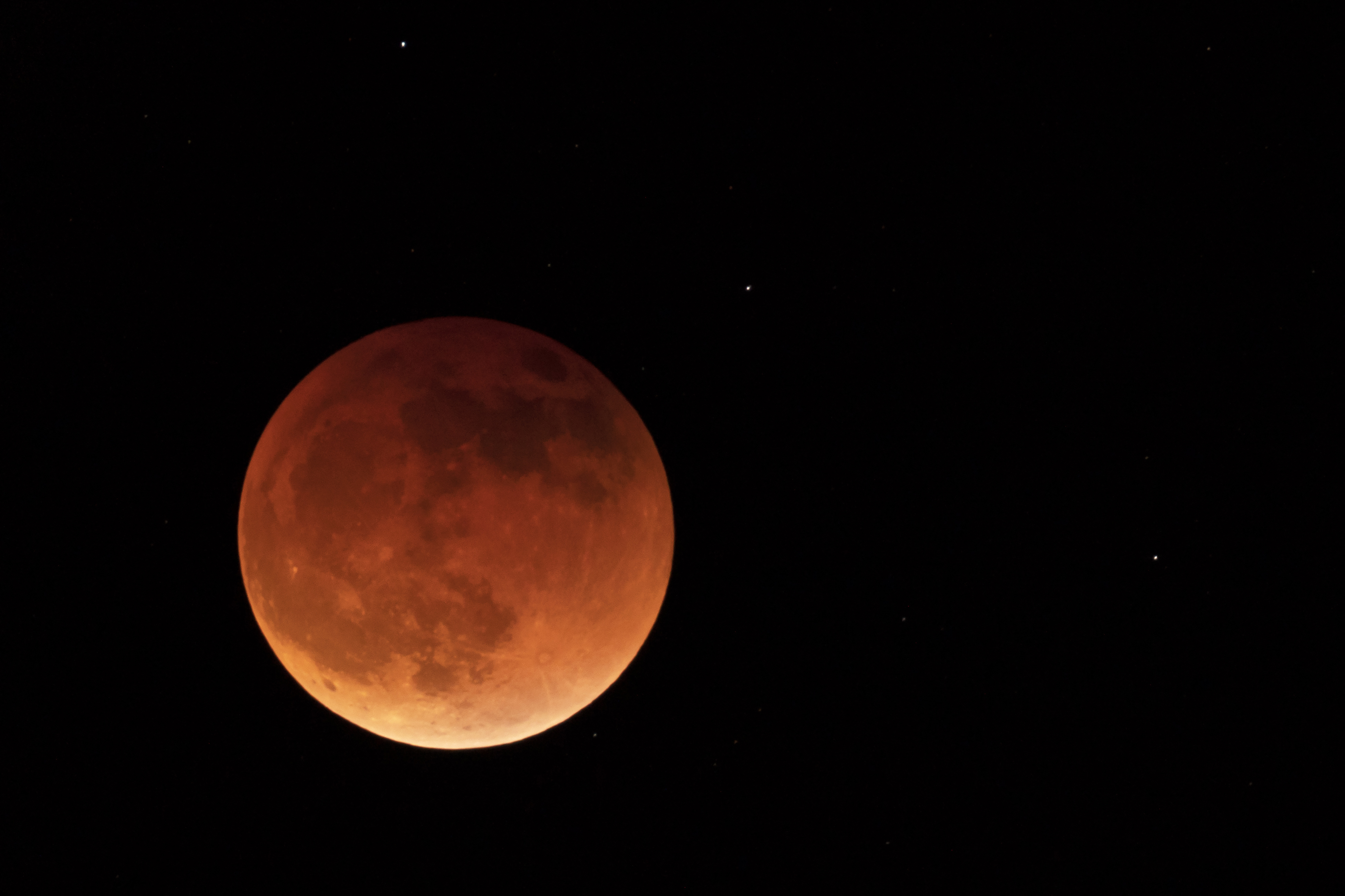 The moon is shown during a full lunar eclipse
