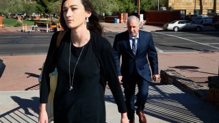 Laney Sweet, left, widow of Daniel Shaver, arrives Oct. 25, 2017, at Maricopa County, Ariz., Superior Court in Phoenix with attorney Mark Geragos, right, for opening statements in the trial of former Mesa, Ariz., Police Officer Philip Brailsford, charged with murder in the fatal 2016 shooting of the unarmed Shaver.