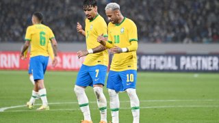 Brazil’s forward Neymar (R) dances with Brazil’s midfielder Lucas Paqueta after scoring a goal in a penalty kick during the friendly football match between Japan and Brazil at the National Stadium in Tokyo on June 6, 2022.