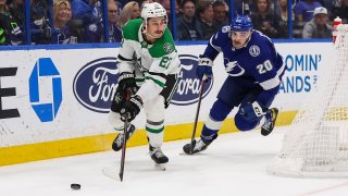 Nicholas Paul #20 of the Tampa Bay Lightning skates against Mason Marchment #27 of the Dallas Stars during overtime at Amalie Arena on November 15, 2022 in Tampa, Florida.
