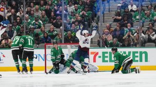 The Colorado Avalanche celebrate a goal against the Dallas Stars at the American Airlines Center on November 21, 2022 in Dallas, Texas.