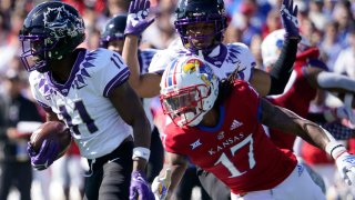 LAWRENCE, KANSAS – OCTOBER 08: Wide receiver Derius Davis #11 of the TCU Horned Frogs runs against Monte McGary #17 of the Kansas Jayhawks at David Booth Kansas Memorial Stadium on October 08, 2022 in Lawrence, Kansas. (Photo by Ed Zurga/Getty Images)
