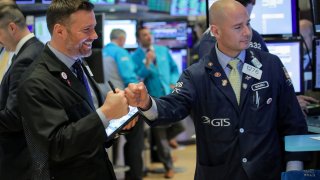 Traders work the floor at the NYSE in New York.