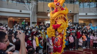 Lion dancers perform at a shopping mall in Beijing on Jan. 26, 2023, during the first Lunar New Year after China relaxed its Covid controls.