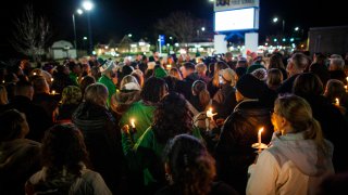 Residents of Newport News hold a candlelight vigil