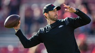 Offensive Coordinator Kendal Briles of the Arkansas Razorbacks warms up before a game against the Missouri Tigers at Donald W. Reynolds Razorback Stadium on November 26, 2021 in Fayetteville, Arkansas. The Razorbacks defeated the Tigers 34-17.