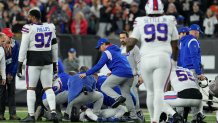 Buffalo Bills' Damar Hamlin is examined during the first half of an NFL football game against the Cincinnati Bengals, Monday, Jan. 2, 2023, in Cincinnati. (AP Photo/Jeff Dean)