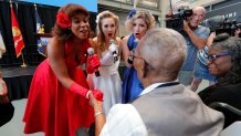 The Victory Belles hold the hands of World War II veteran Lawrence Brooks as they sing him happy birthday celebrating his 110th birthday at the National World War II Museum in New Orleans, Thursday, Sept. 12, 2019. Brooks was born Sept. 12, 1909, and served in the predominantly African-American 91st Engineer Battalion, which was stationed in New Guinea and then the Philippines during World War II. He was a servant to three white officers in his battalion. (AP Photo/Gerald Herbert)