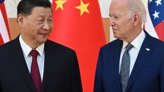 US President Joe Biden and China’s President Xi Jinping (L) shake hands as they meet on the sidelines of the G20 Summit in Nusa Dua on the Indonesian resort island of Bali on November 14, 2022.