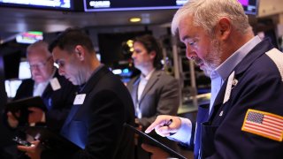 Traders work on the floor of the New York Stock Exchange during morning trading on March 08, 2023 in New York City.