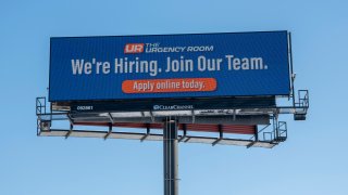 Vadnais Heights, Minnesota, The Urgency Room medical facility posts a hiring sign on local billboard looking for experienced staff.