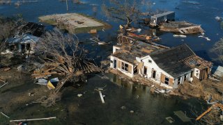 CREOLE, LOUISIANA – OCTOBER 10: An aerial view of flood waters from Hurricane Delta surrounding structures destroyed by Hurricane Laura on October 10, 2020 in Creole, Louisiana. Hurricane Delta made landfall near Creole as a Category 2 storm in Louisiana initially leaving some 300,000 customers without power. (Photo by Mario Tama/Getty Images)