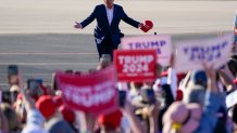 Former President Donald Trump walks across the tarmac as he arrives to speak at a campaign rally at Waco Regional Airport Saturday, March 25, 2023, in Waco, Texas.