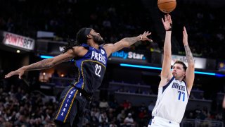 Dallas Mavericks guard Luka Doncic (77) shoots over Indiana Pacers forward Isaiah Jackson (22) during the first half of an NBA basketball game in Indianapolis, Monday, March 27, 2023.