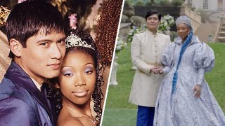 A photo showing Brandy and Paolo Montalban in their 1997 role as Cinderella and Prince Charming, next to an image of the two in their new roles as Queen Cinderella and King Charming for Disney's Descendants. King Charming is dressed in a white and gold tunic with navy pants, while Queen Cinderella wears a large tiara, a blue and white brocaded dress with puffed sleeves and has long blue hair tied up in a fishtail braid.