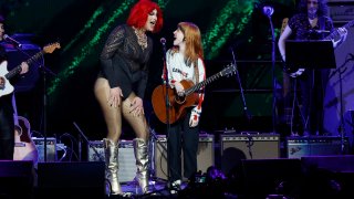 FILE - Hayley Williams (R) and a Nashville Drag Queen performs for a benefit concert in Nashville, Tenn., on March 20, 2023.