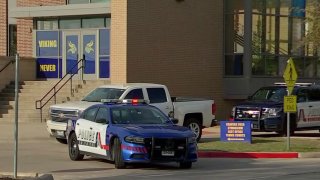 Arlington Police investigate a shooting at Lamar High School on Monday, March 20, 2023.