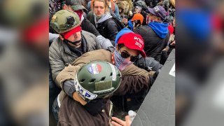 Edward Badalian, in the red hat, at the U.S. Capitol on Jan. 6, 2021.