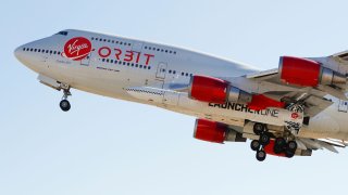 Richard Branson’s Virgin Orbit, with a rocket under the wing of a modified Boeing 747 jetliner, takes off for a key drop test of its high-altitude launch system for satellites from Mojave, California, July 10, 2019.