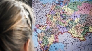 A schoolgirl looks at a computer screen showing a map of Russia including annexed Ukrainian territories in Moscow on Oct. 12, 2022.