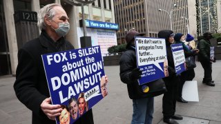 Members of Rise and Resist participate in their weekly “Truth Tuesday” protest at News Corp headquarters on February 21, 2023 in New York City. 